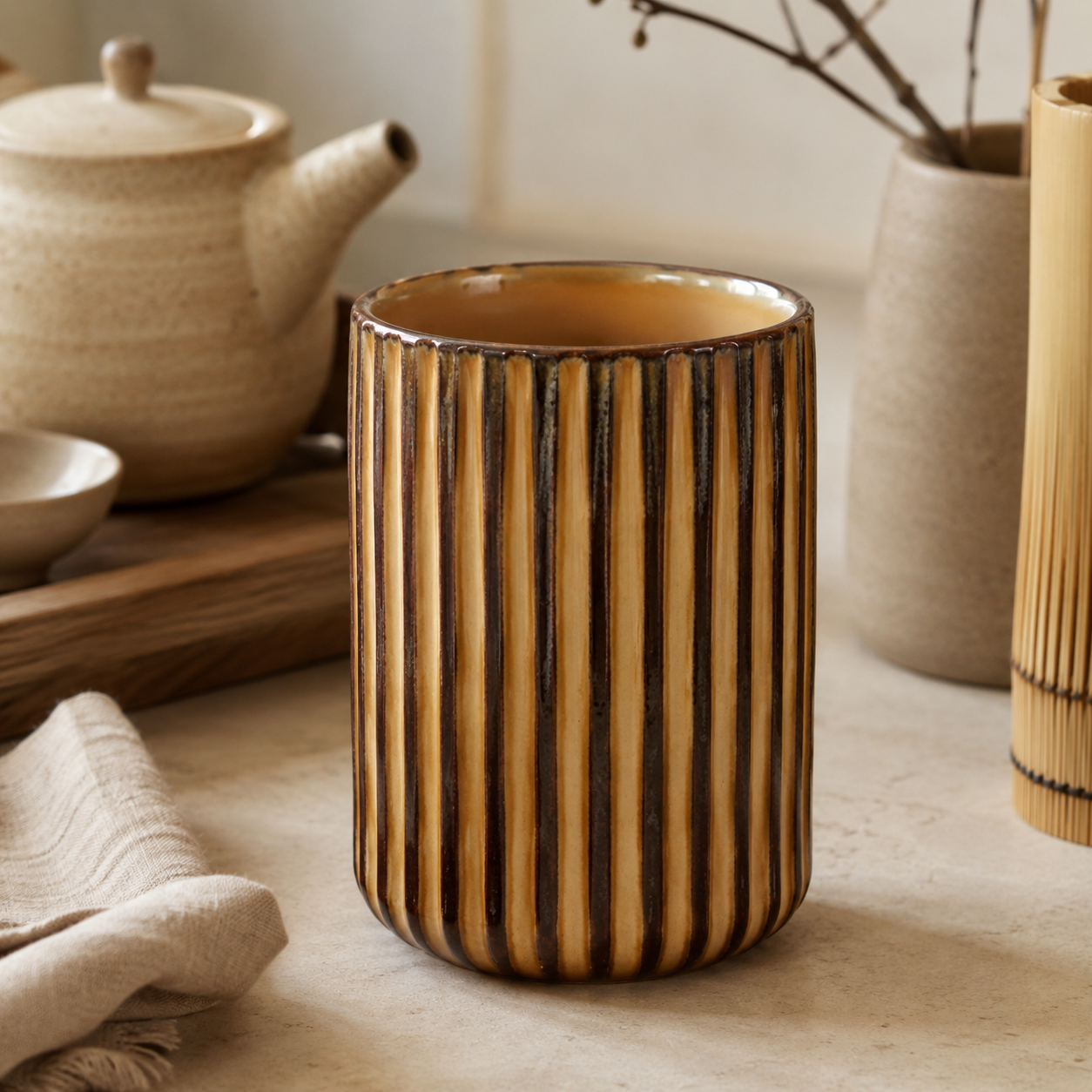 Vintage Japanese ceramic tea cup with vertical ribbed texture and warm brown glaze.
