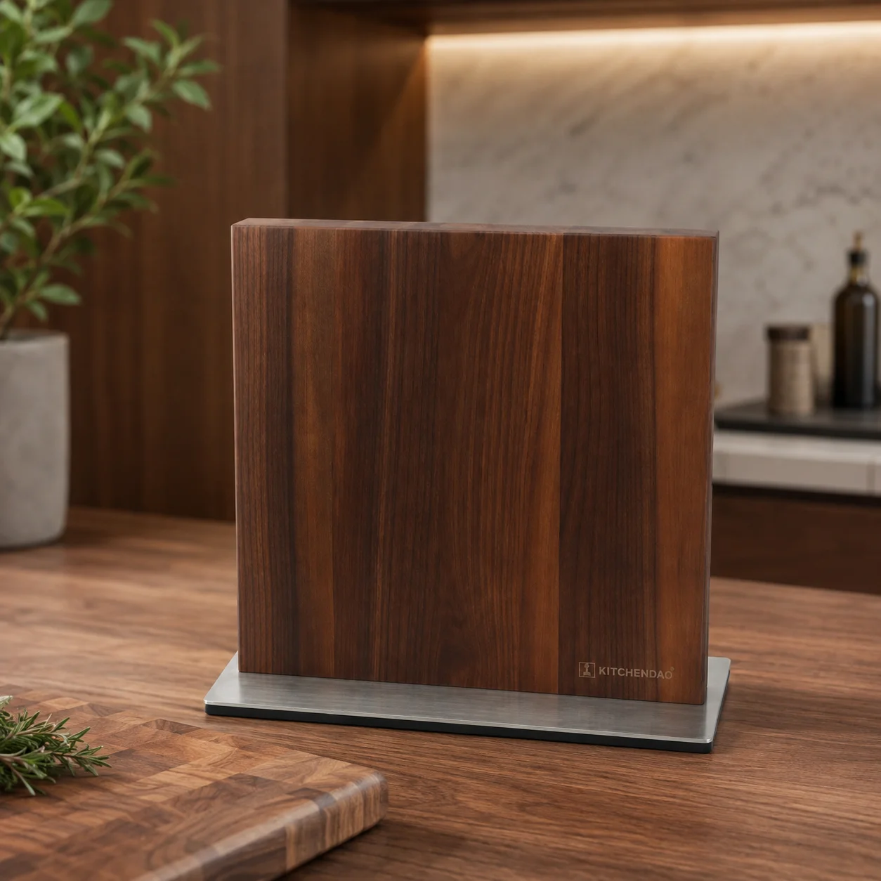 Rectangular dark walnut magnetic knife block standing on a stainless steel base on a wooden countertop.